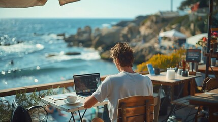 A young professional working on a laptop at a cosy beachside. Flexible working and freedom of remote work Concept