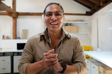 Young man attending video call looking at camera