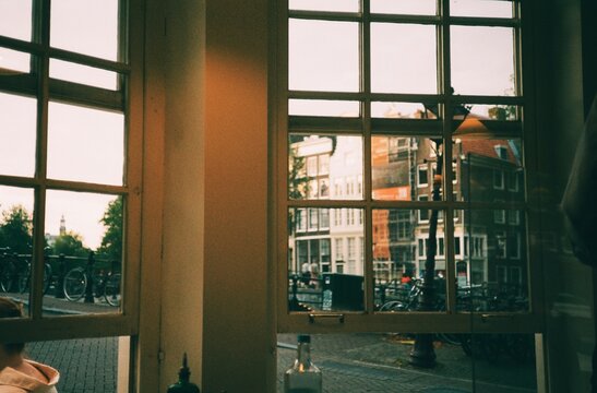 Sunset light on the window  overlooking a canal street, 35mm film