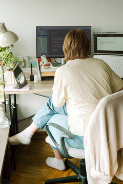 Portrait of a young female programmer on her workplace 