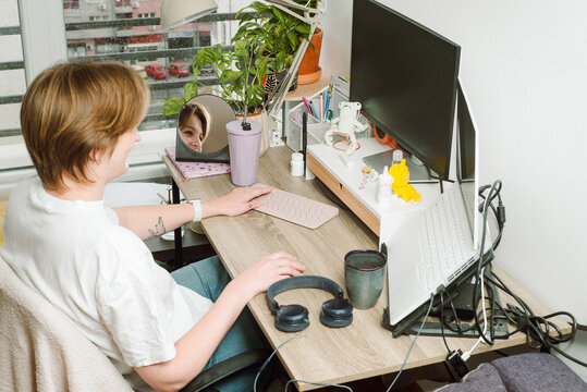 Portrait of a young female programmer on her workplace 