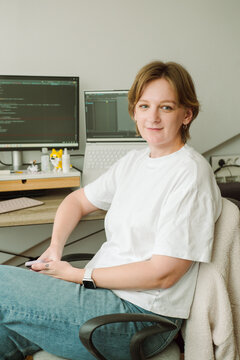 Portrait of a young female programmer near her workplace 