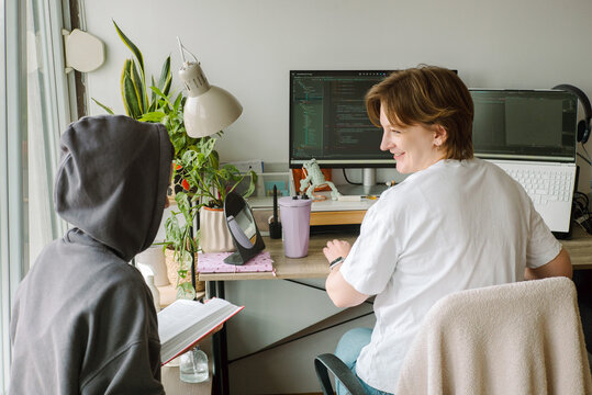 Young female colleagues discussing an actual IT project