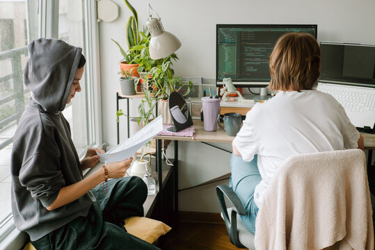 Young female colleagues discussing an actual IT project