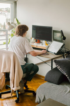Portrait of a young female programmer on her workplace 