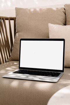 Mockup Laptop with withe screen at Cozy Cafe