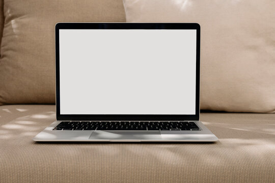 Laptop Mockup On A Chair