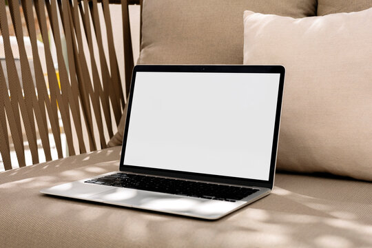 Mockup Laptop with withe screen at Cozy Home
