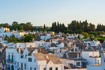 View of the famous old dry stone trulli houses with conical roofs in Alberobello, Italy
