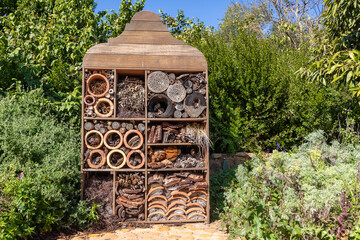 A large bug hotel with different kind of shards of clay pottery and wooden elements.  Big hotels...