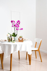 Beautiful table setting with orchid flower for wedding celebration in room