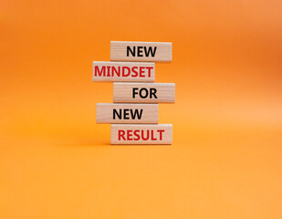 Mindset symbol. Wooden blocks with words New Mindset new Result. Beautiful orange background. Business and New Mindset new Result concept. Copy space.