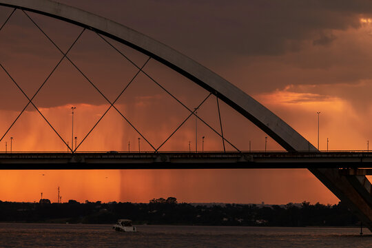Sunset over the Paranoa Lake with rain in the background