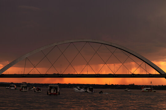Sunset over the Paranoa Lake with rain in the background