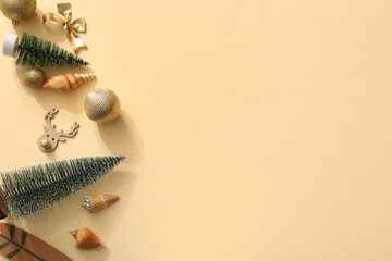 Naklejka premium Composition with Christmas decorations and seashells on color background