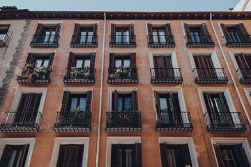 Facade of an apartment block building in Old Town, Madrid, Spain.