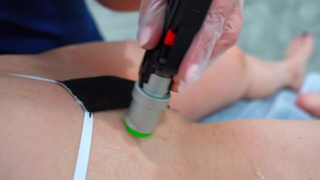 Alexandrite Laser in aesthetic medicine. Woman on laser hair removal treatments bikini area. Beautician removes hair on bikini zone, using a laser. Receiving laser epilation on bikini zone