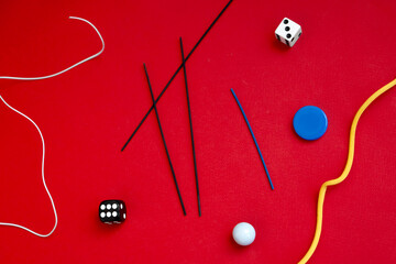 Abstract composition with game elements on red background. 