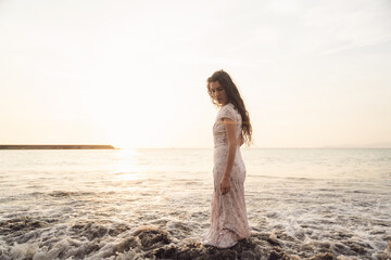Serene Woman Enjoying Sunset at the Beach