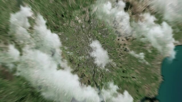 Zooming on Glasgow, Scotland. Earth zoom in from outer space to city. The animation continues by zoom out through clouds and atmosphere into space. View of the Earth at night. Images from NASA. 4K