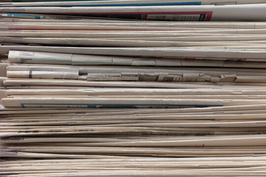 Close up of stacked old newspapers