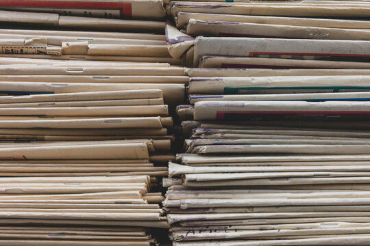 Close up of stacked old newspapers