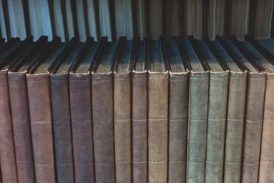 Row of old books on shelf