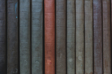Row of old books on shelf
