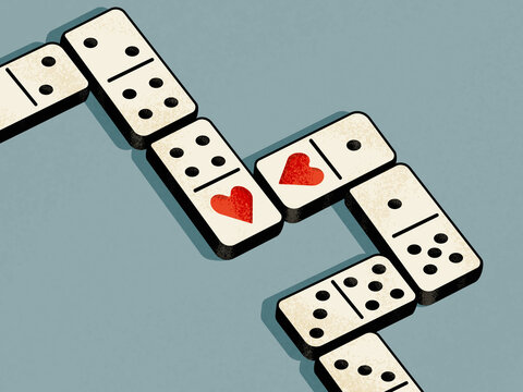Domino with hearts represents the concept of love