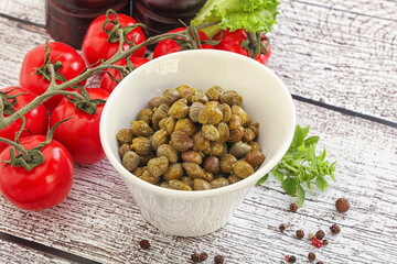 Marinated green capers in the bowl