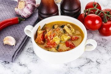 Traditional yellow Thai curry with chicken