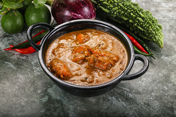 Indian cuisine - chicken curry with spices