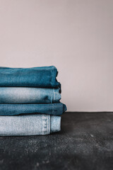 Stack of Various Shades Of Blue Jeans On White Background Denim jeans texture