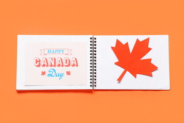 Maple leaf and greeting card on red background. Canada Day concept