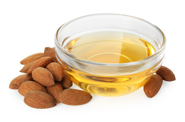 Almond oil in bowl and fresh nuts isolated on white