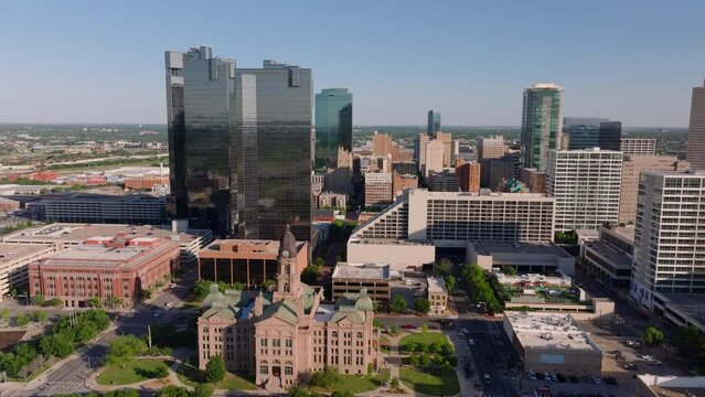 Downtown Fort Worth, Texas, blending historic and modern buildings including the County Courthouse from an aerial point of view on a clear day
