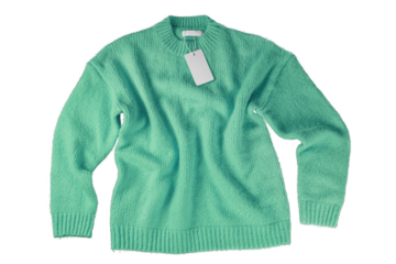 Green flying crumpled women autumn knitted sweater with blank label tag isolated on white, transparent  background. Creative clothing concept, cozy creasy jersey pullover. Fashion template, mockup