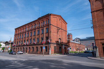 The characteristic red brick industrial buildings of the former textile factories in Żyrard&oacute;w, Poland, stand as enduring symbols of the town's rich industrial heritage.