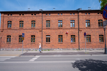 The characteristic red brick industrial buildings of the former textile factories in Żyrard&oacute;w, Poland, stand as enduring symbols of the town's rich industrial heritage.