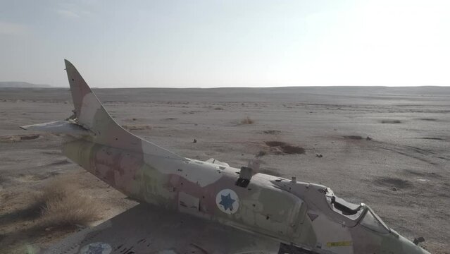 Aerial video of an abandoned fighter plane in the desert, Israel
