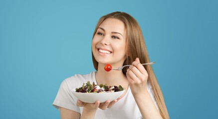 Healthy Meal. Happy Woman Eating Fresh Salad