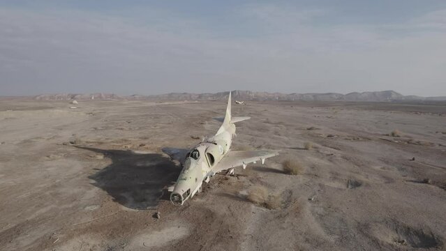 Aerial video of an abandoned fighter plane in the desert, Israel