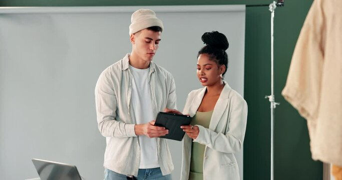 Photographer, tablet and people in studio in discussion on set for camera shot, photography and backstage. Photoshoot, teamwork and man and woman on tech for shooting fashion for magazine catalog