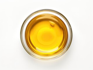 A single serving of olive oil sitting on a clean white surface, perfect for cooking or as a prop for food styling
