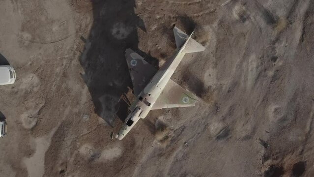 Aerial video of an abandoned fighter plane in the desert, Israel