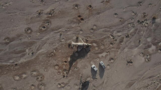 Aerial video of an abandoned fighter plane in the desert, Israel