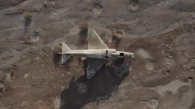 Aerial video of an abandoned fighter plane in the desert, Israel