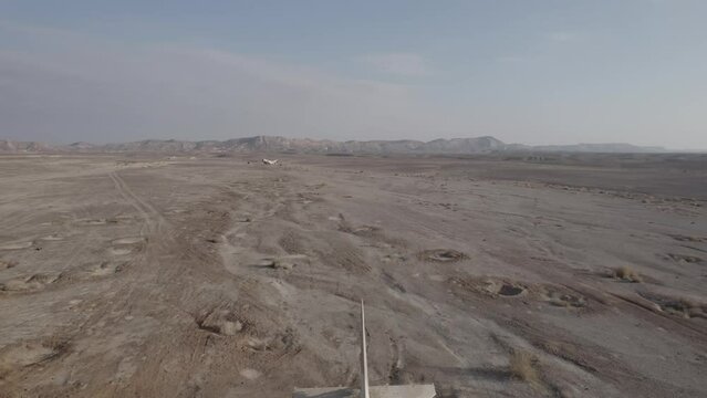 Aerial video of an abandoned fighter plane in the desert, Israel