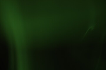 green smoke on a dark background, colourful abstract, green fog, minimalism, line of light