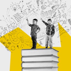 Happy pupils on set of huge books
